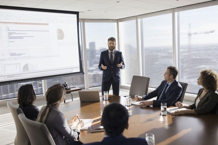 VC mentor presenting to students in a boardroom